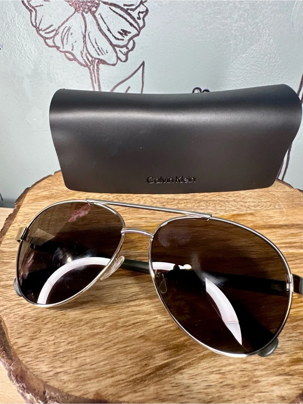 Calvin Klein Men’s Silver Frame Sunglasses with Black Lenses